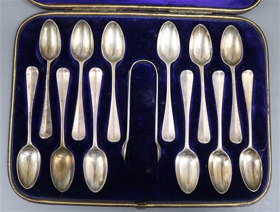 A cased set of twelve Victorian silver Hanovarian rat tail pattern teaspoons, and matching tongs, London 1879.